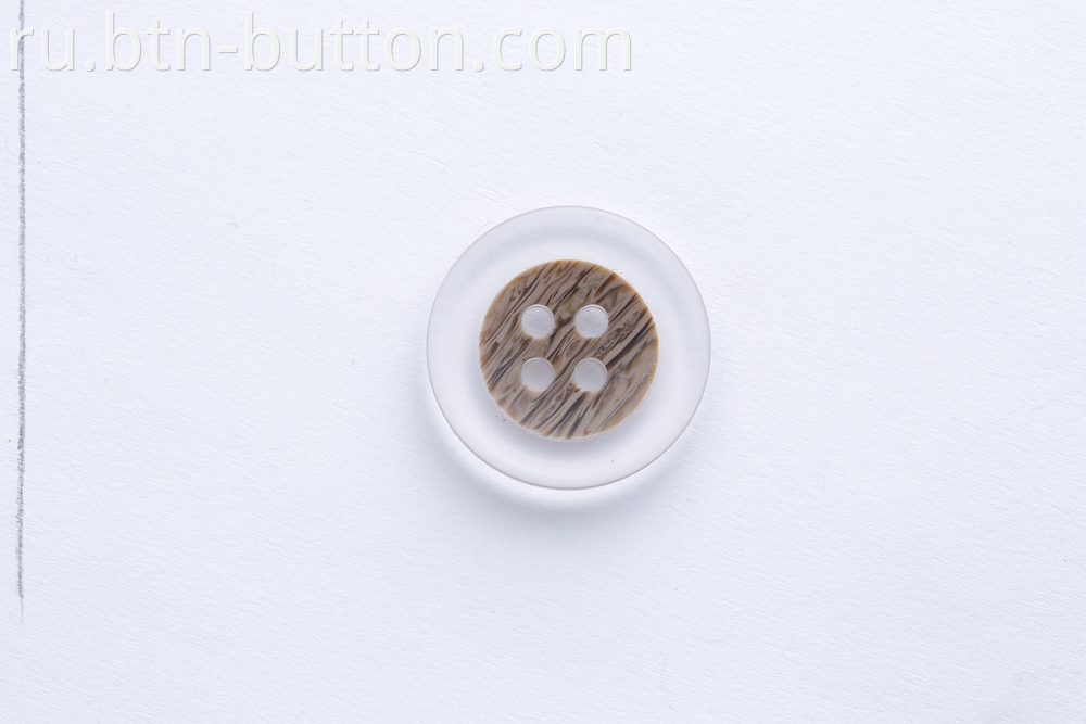 Transparent buttons on the nest surface for trench coats